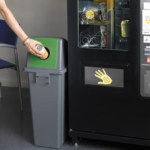 Recycling bin next to vending machine