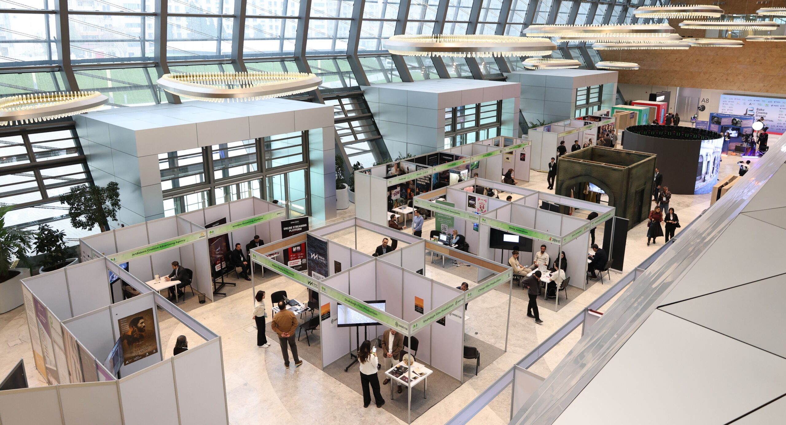 Trade show with people visiting the various stands