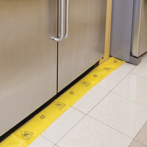 Absorbent yellow strip along base of kitchen unit