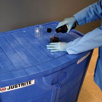Undercounter Corrosive chemical cabinet being used as a work surface.