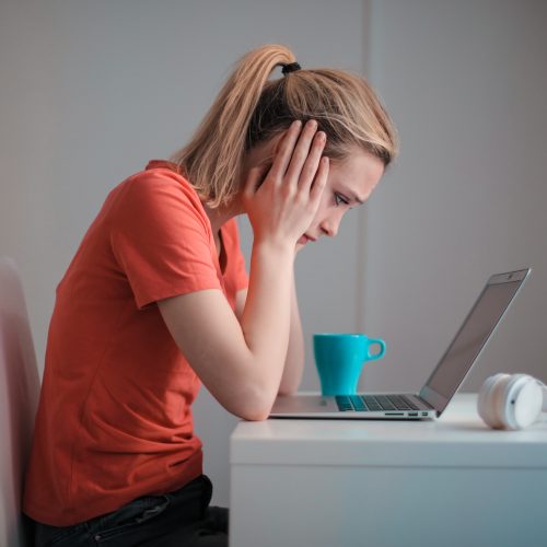 Woman sits with bad posture