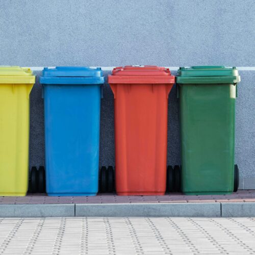 Row of coloured wheelie bins