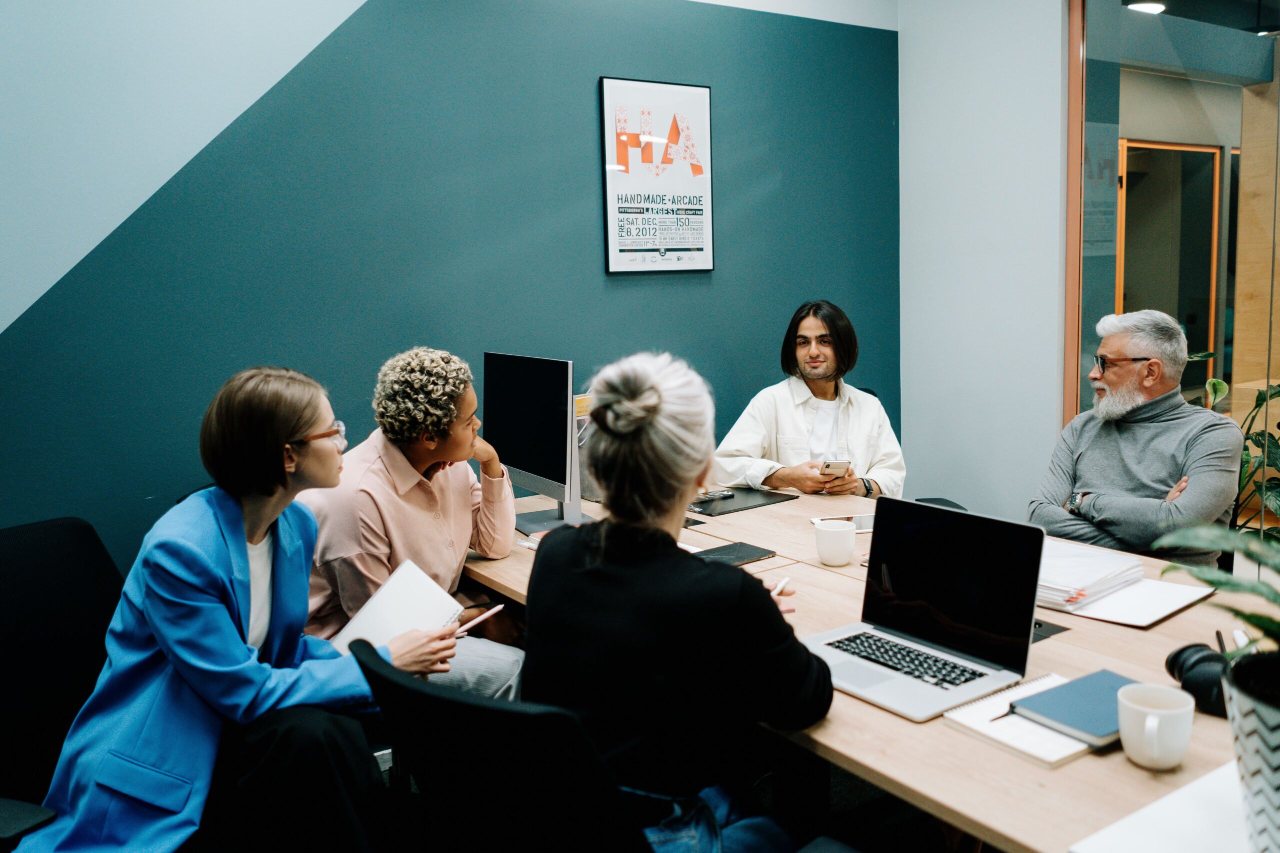 People round a table at a meeting