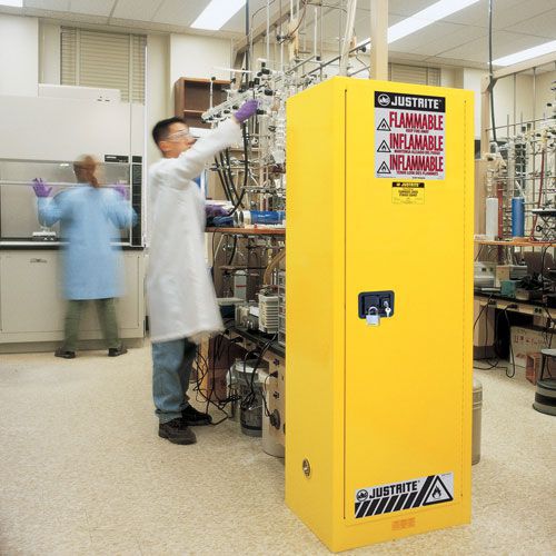 Slimline flammable storage cabinet being used in lab. Slimline flammable storage cabinet being used in lab.